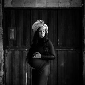 “Barely There” black mesh maternity dress